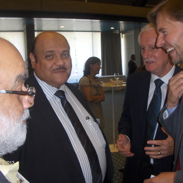 Delegates networking between sessions at a previous World Maintenance Forum